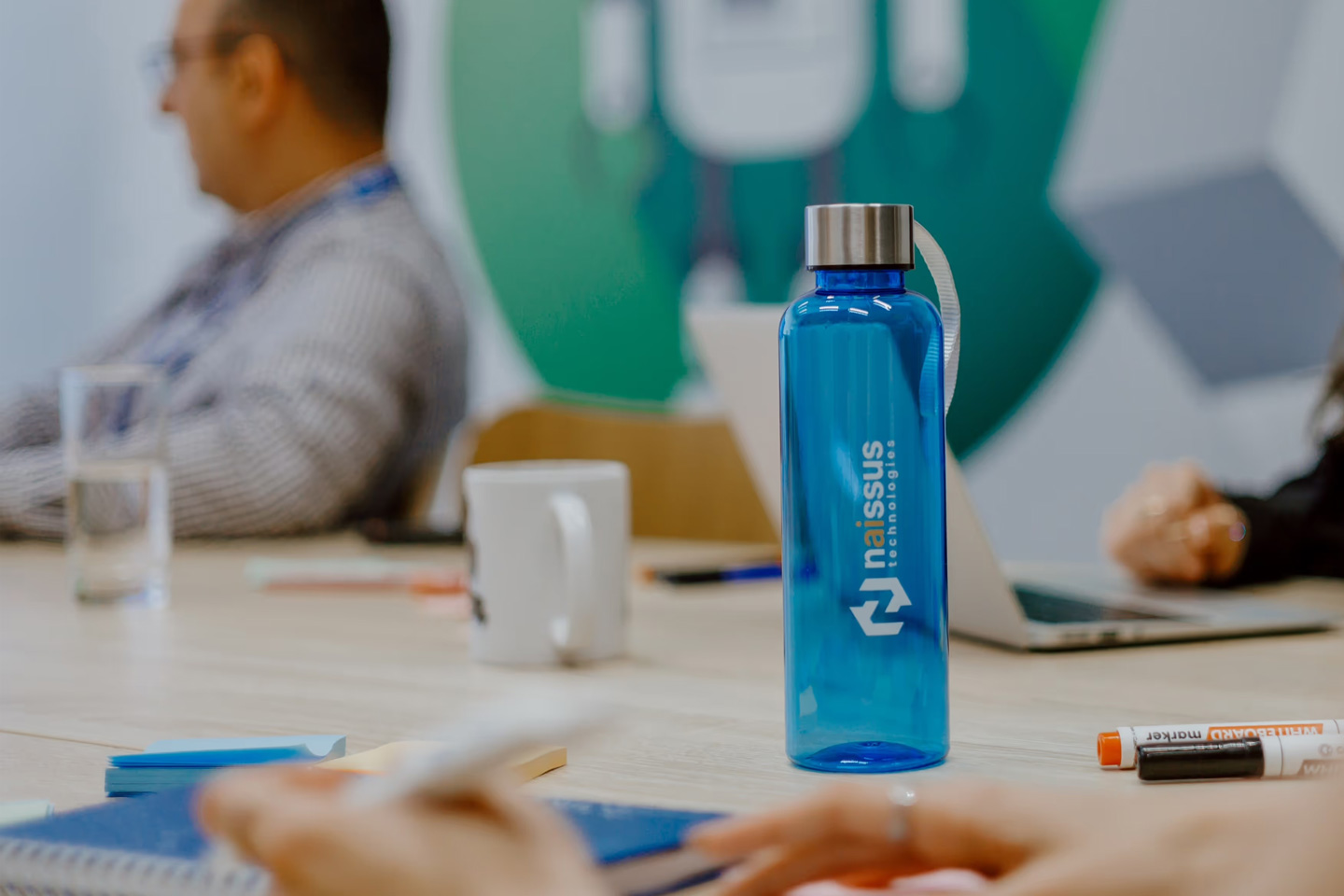 Naissus Technologies team at work, with our signature blue bottle