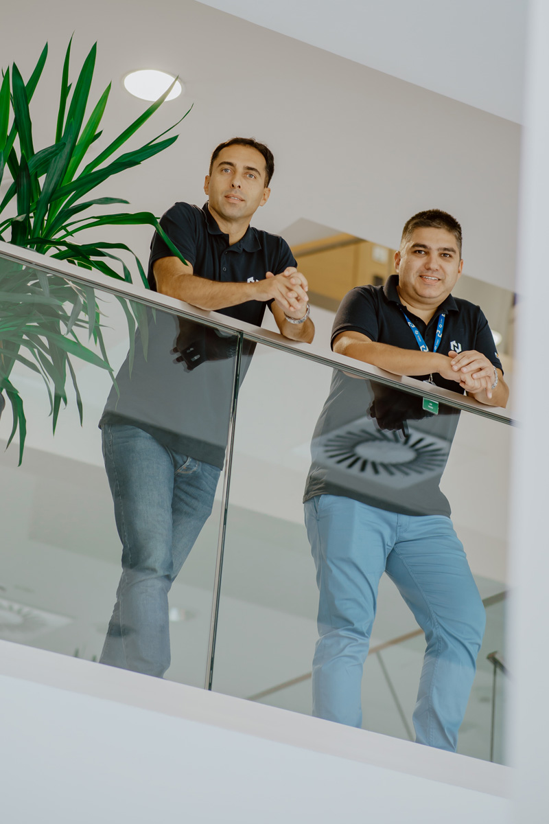 Naissus colleagues standing together at the office balcony